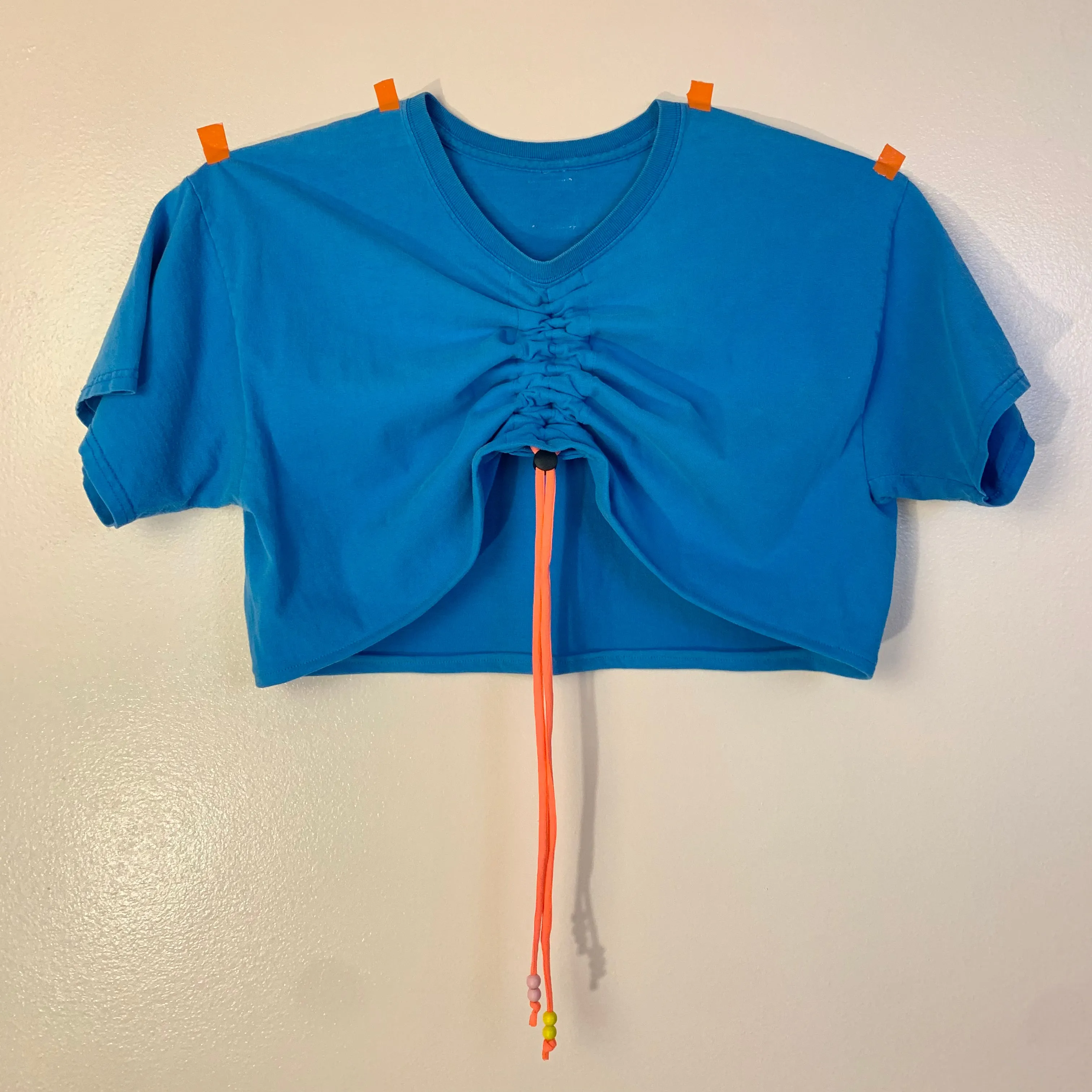 Bright blue ruch front tee