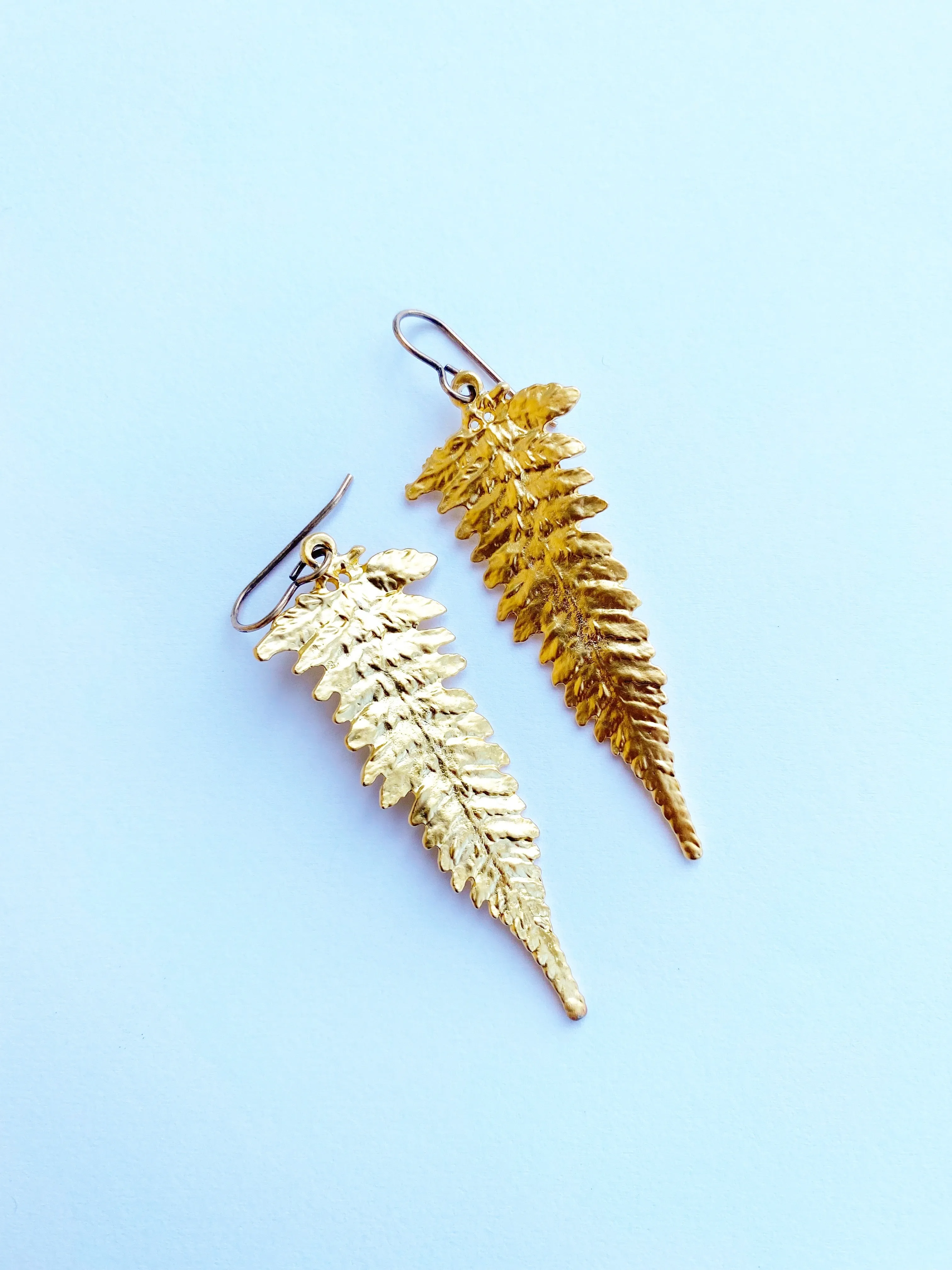 Gold Ferns. Fern detailed gold charm earrings.