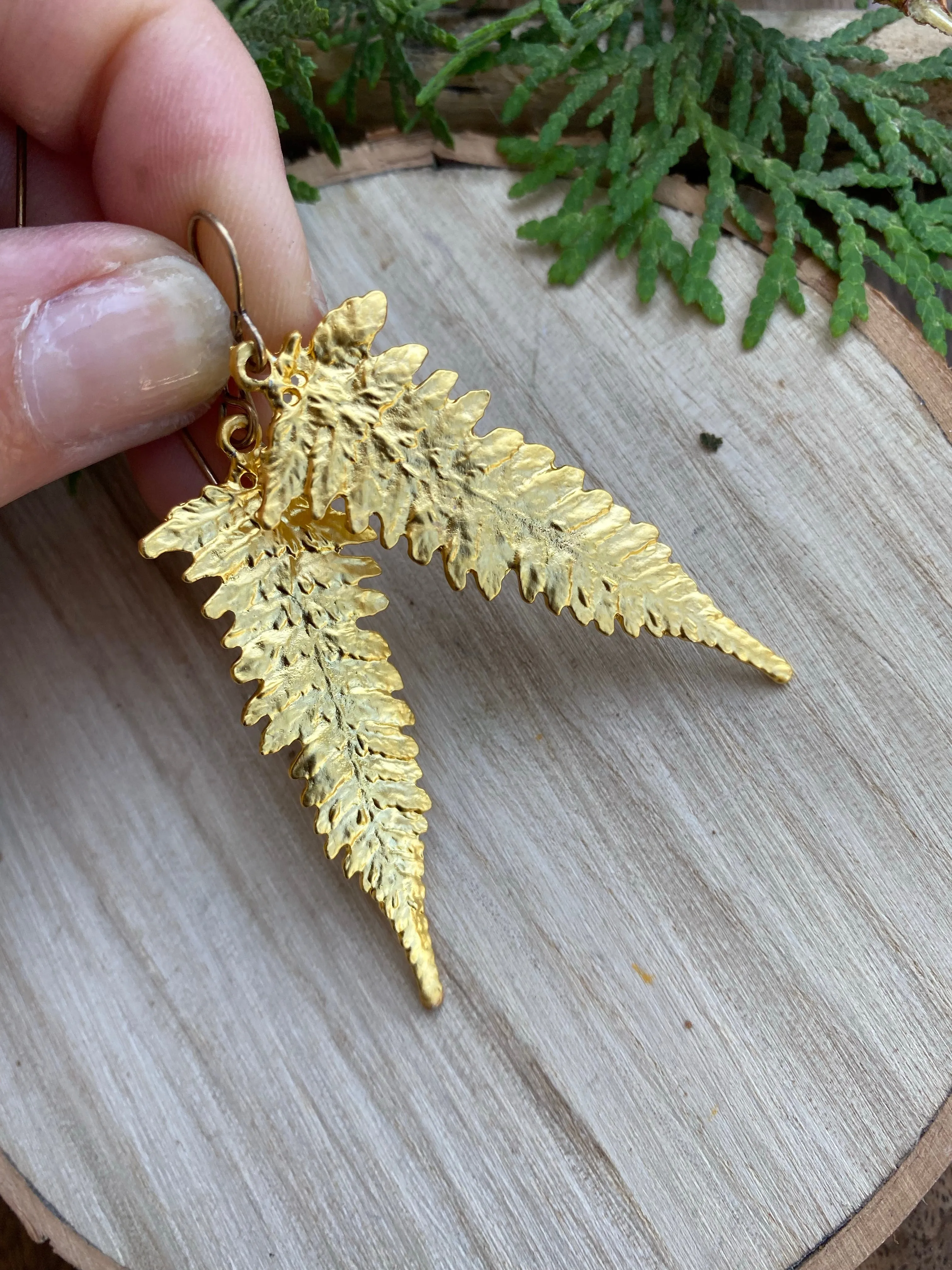 Gold Ferns. Fern detailed gold charm earrings.