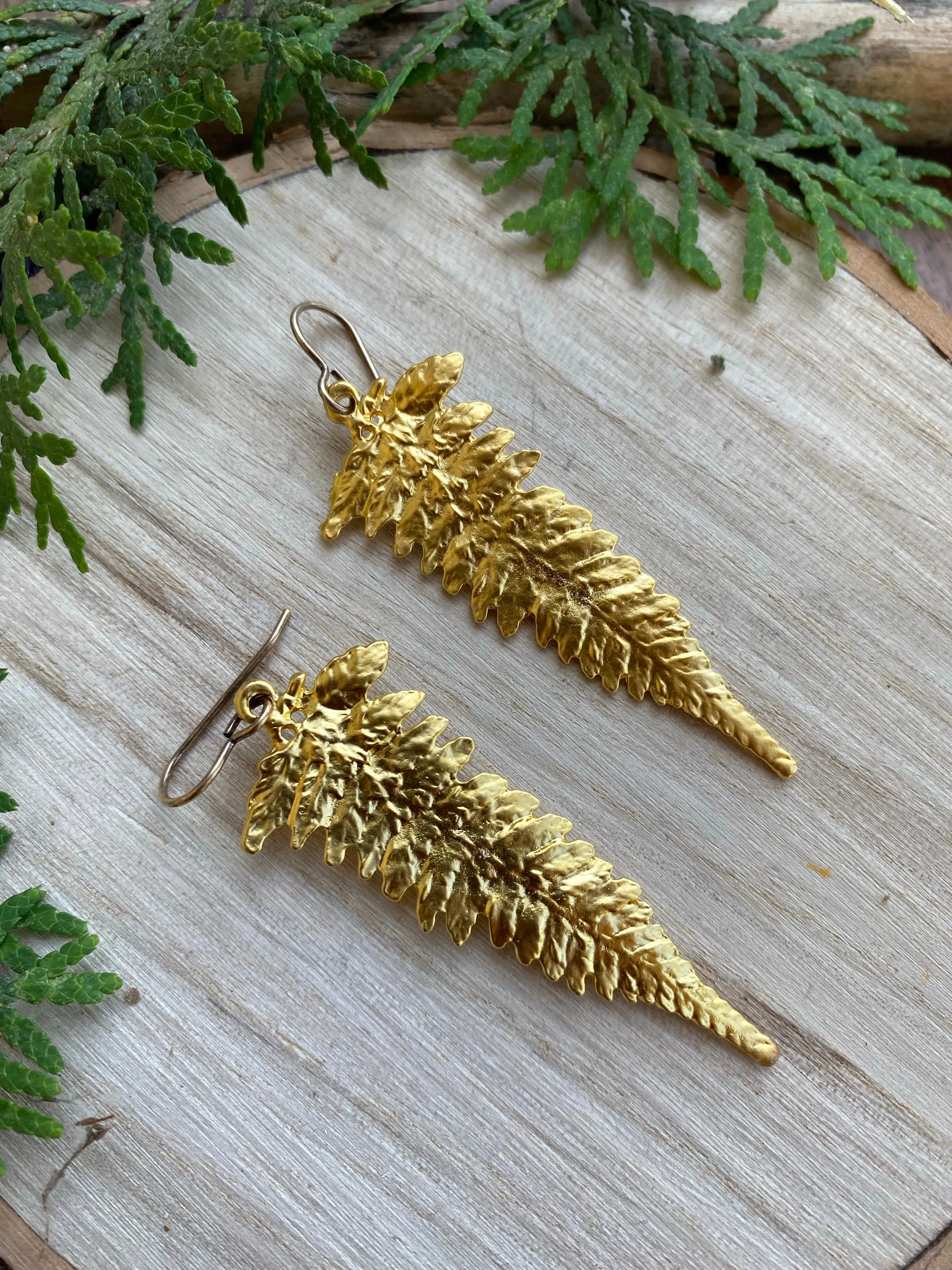 Gold Ferns. Fern detailed gold charm earrings.